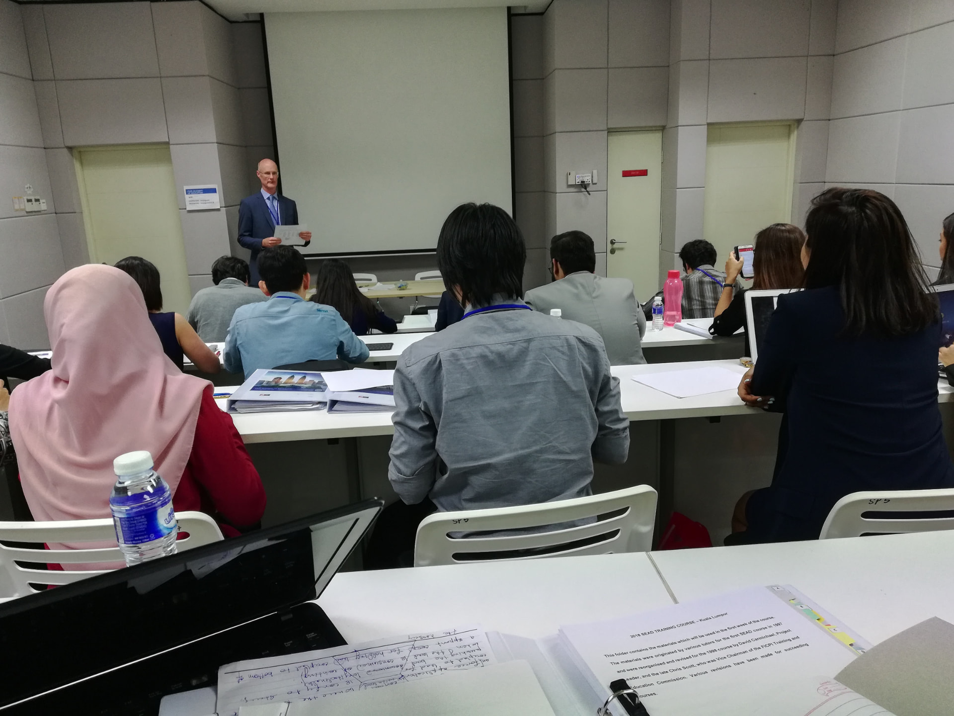 Participants seated in a classroom during a FICPI SEAD patent drafting training session.